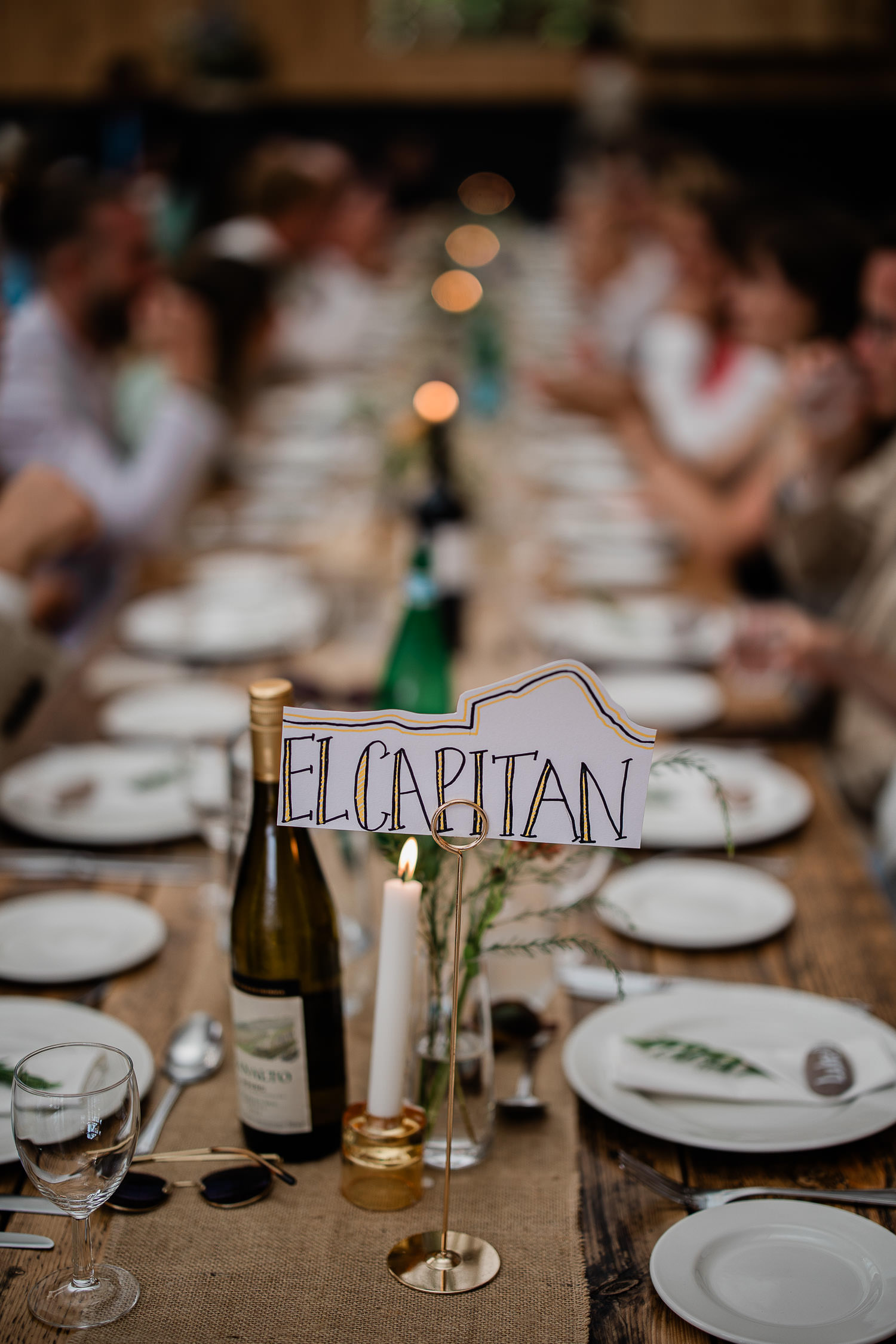 Warm and atmospheric table settings for a barn wedding at The Grain Store, Devon.