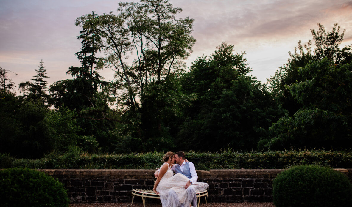 A bride and groom have an intimate moment away from the wedding, during a Huntsham court photography session.